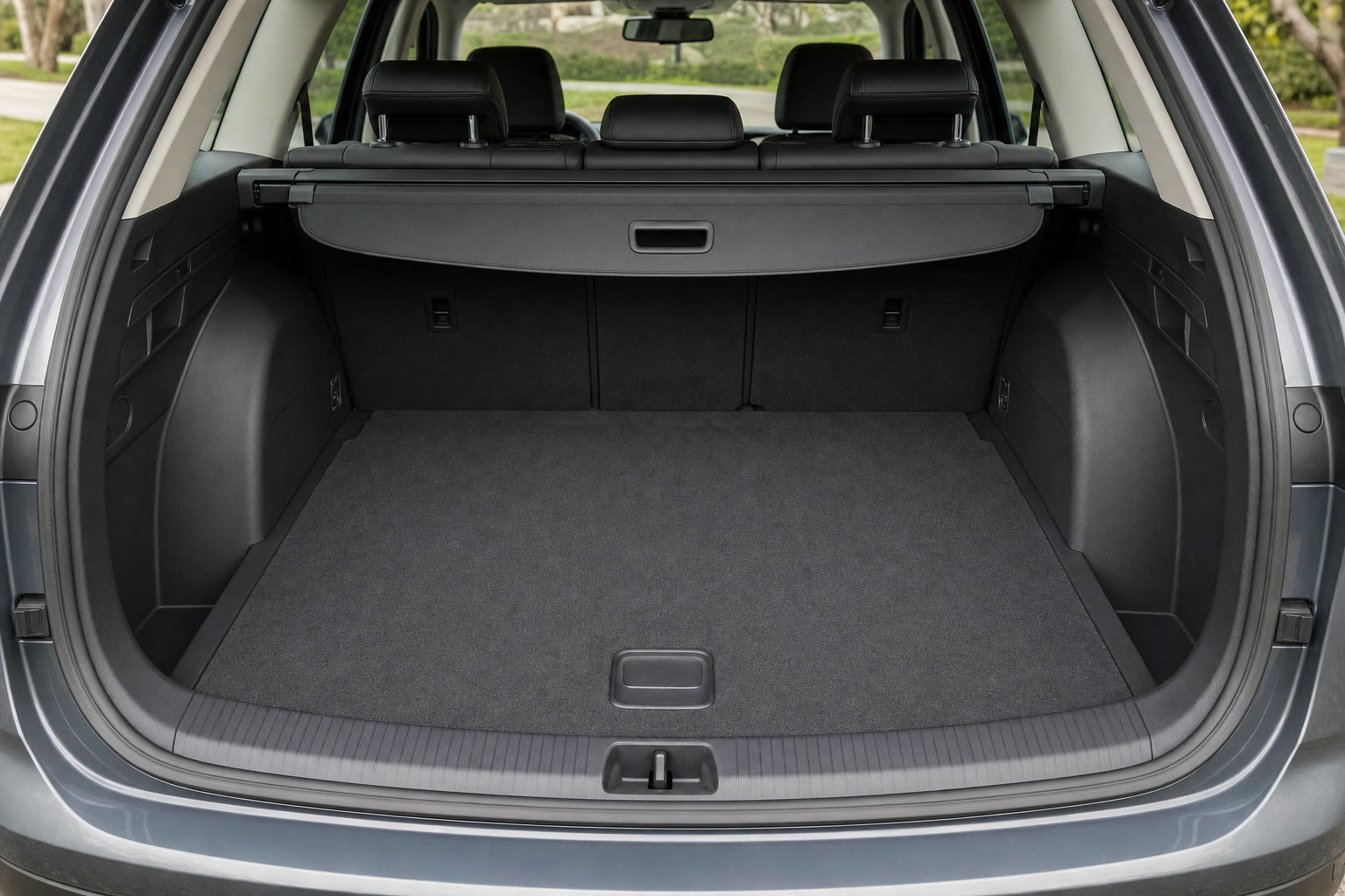 Clean, vacuumed trunk and cargo area of an SUV after detailing